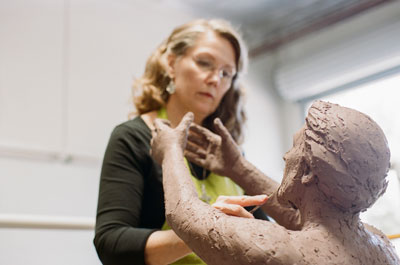 Karen Schmidt sculpting Joseph in Holy Family sculpture